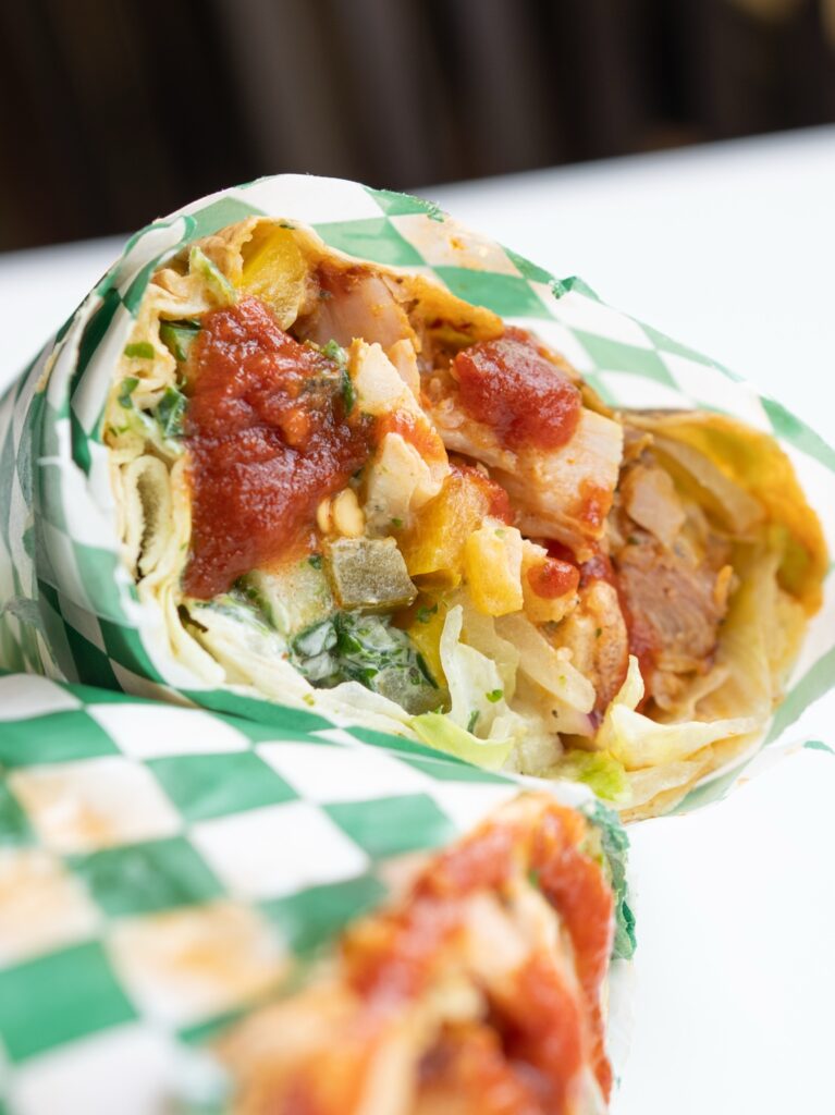 In & Win Donair wrap with sliced meat, vegetables and sauce